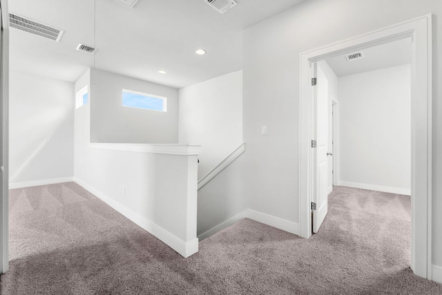 2201 Cento Walk Unit 70, Round Rock, TX 78664 - corridor featuring an upstairs landing, carpet flooring, baseboards, and recessed lighting