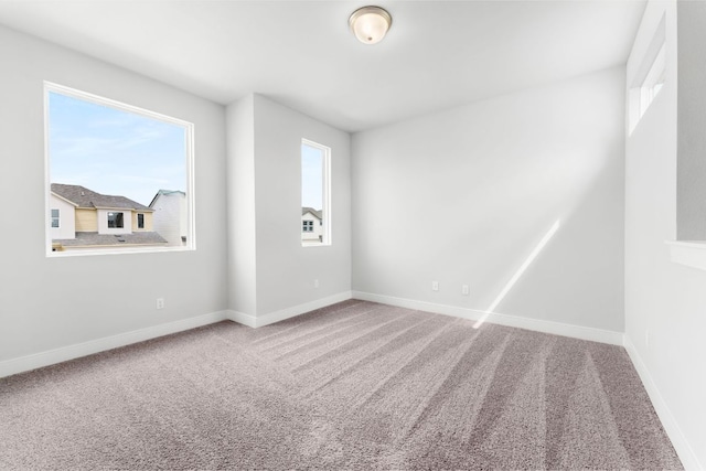 2201 Cento Walk Unit 70, Round Rock, TX 78664 - spare room featuring carpet floors and baseboards