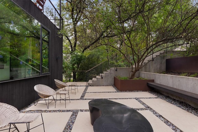 2700 Stratford Dr, Austin, TX 78746 - view of patio / terrace featuring stairway