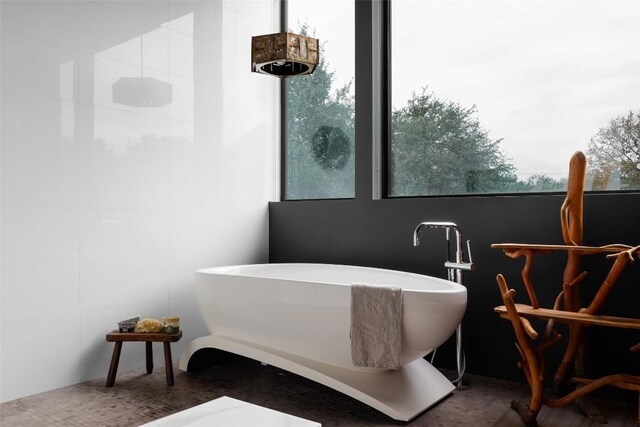 2700 Stratford Dr, Austin, TX 78746 - full bath with a freestanding tub and healthy amount of natural light