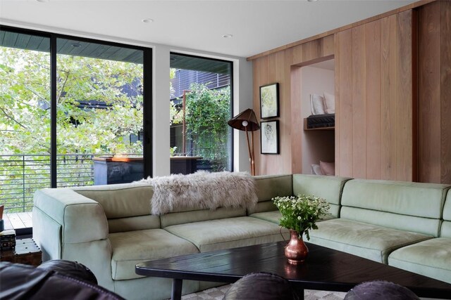 2700 Stratford Dr, Austin, TX 78746 - living area with wood walls and expansive windows
