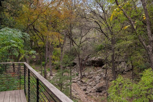 2700 Stratford Dr, Austin, TX 78746 - deck featuring a wooded view