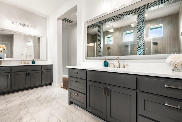 2421 High Lonesome, Leander, TX 78641 - full bathroom featuring a sink, walk in shower, marble finish floor, and visible vents