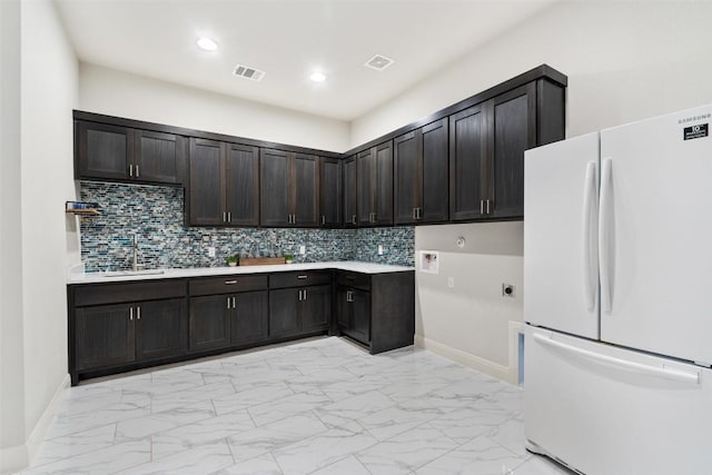 2421 High Lonesome, Leander, TX 78641 - clothes washing area with electric dryer hookup, visible vents, cabinet space, a sink, and marble finish floor
