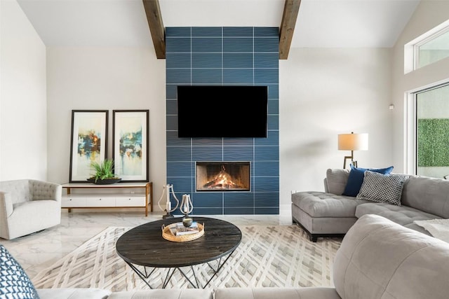 2421 High Lonesome, Leander, TX 78641 - living area with vaulted ceiling with beams, marble finish floor, and a fireplace