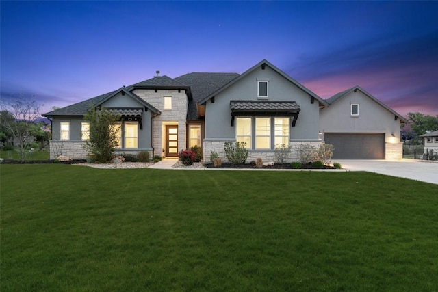 2421 High Lonesome, Leander, TX 78641 - modern farmhouse style home featuring concrete driveway, a yard, stone siding, and stucco siding