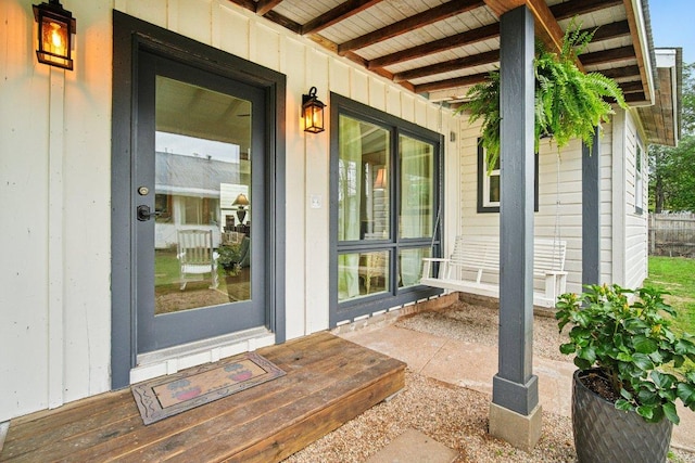 entrance to property featuring covered porch