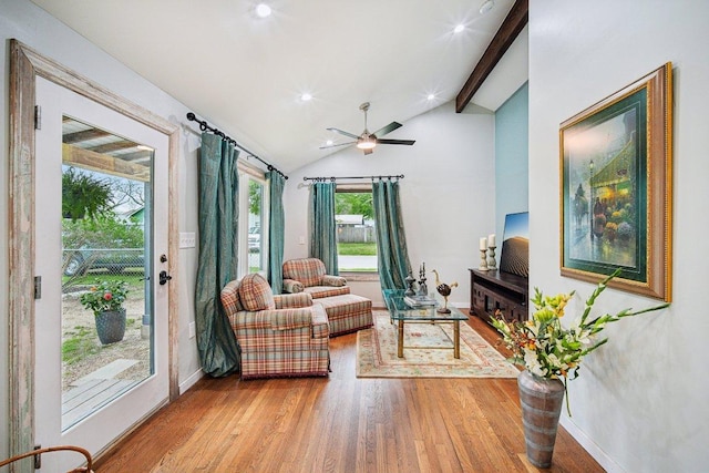 living room featuring baseboards, wood finished floors, recessed lighting, a ceiling fan, and vaulted ceiling with beams