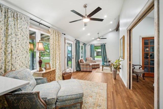 living room with wood finished floors, recessed lighting, high vaulted ceiling, and ceiling fan