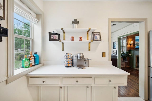 kitchen featuring light countertops and white cabinets