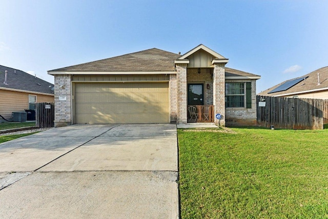 218 Wells Bnd, Hutto, TX 78634 - view of front of home featuring concrete driveway, an attached garage, and brick siding