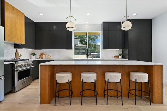 3004 Ray Wood Dr, Austin, TX 78704 - kitchen with high end range, modern cabinets, dark cabinets, and recessed lighting