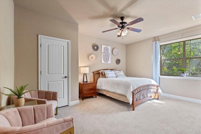 2608 Lightfoot Trl, Austin, TX 78745 - bedroom with carpet floors, baseboards, and ceiling fan