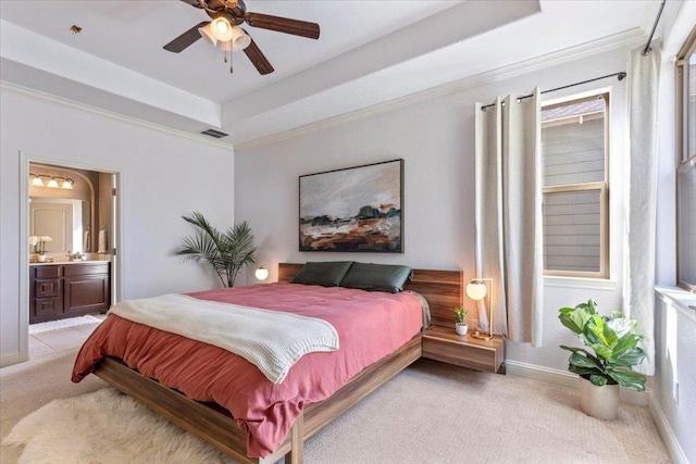 2608 Lightfoot Trl, Austin, TX 78745 - bedroom with light colored carpet, a raised ceiling, ensuite bath, crown molding, and ceiling fan