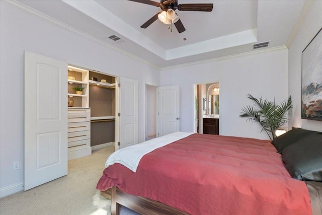 2608 Lightfoot Trl, Austin, TX 78745 - bedroom with carpet, a raised ceiling, a spacious closet, crown molding, and ensuite bath