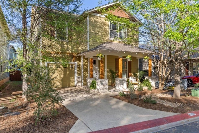 2608 Lightfoot Trl, Austin, TX 78745 - view of front of house featuring a porch, concrete driveway, and a garage