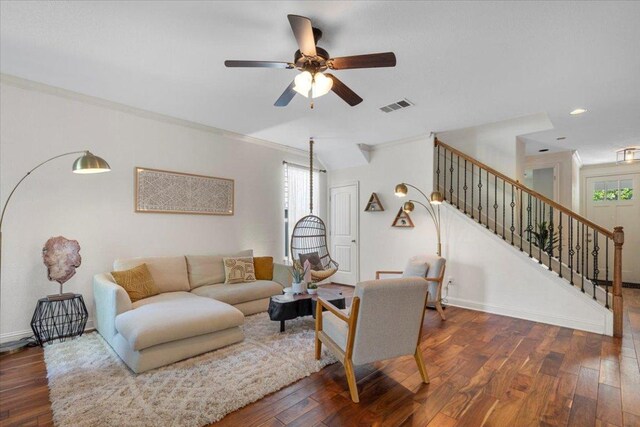 2608 Lightfoot Trl, Austin, TX 78745 - living area featuring plenty of natural light, wood finished floors, stairway, ceiling fan, and ornamental molding