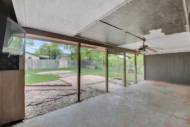 view of patio / terrace featuring fence and a ceiling fan