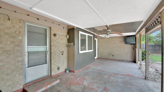 exterior space with ceiling fan