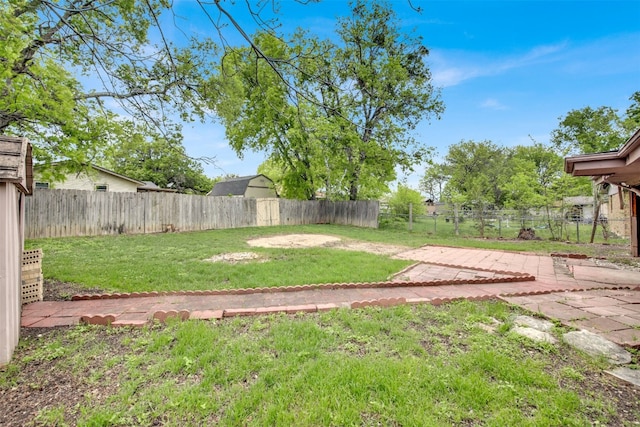 view of yard with a fenced backyard and a patio area