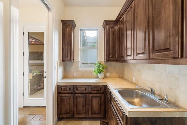 15086 Barrie Dr, Austin, TX 78734 - kitchen with a sink, tile countertops, and decorative backsplash