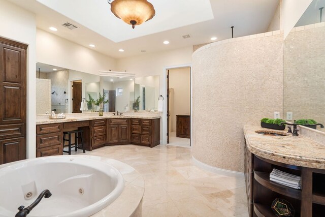 15086 Barrie Dr, Austin, TX 78734 - bathroom featuring a tub with jets, vanity, a walk in shower, and recessed lighting