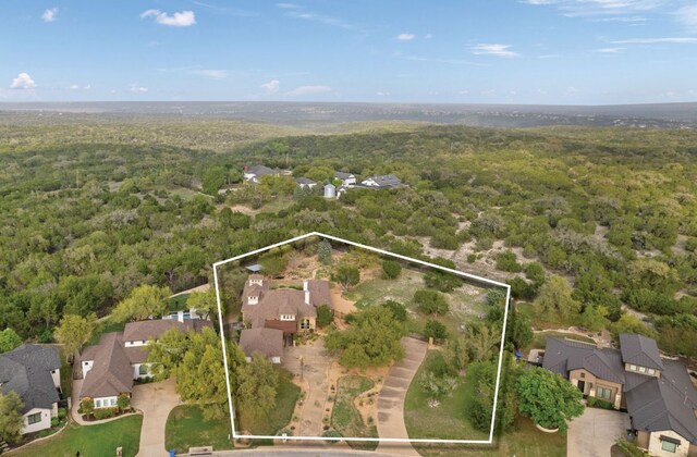 15086 Barrie Dr, Austin, TX 78734 - aerial overview of property's location with a forest, property boundaries highlighted, and nearby suburban area