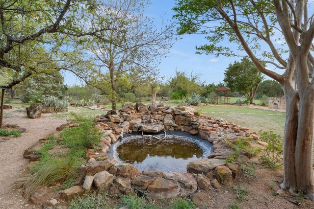 15086 Barrie Dr, Austin, TX 78734 - view of yard featuring a small pond