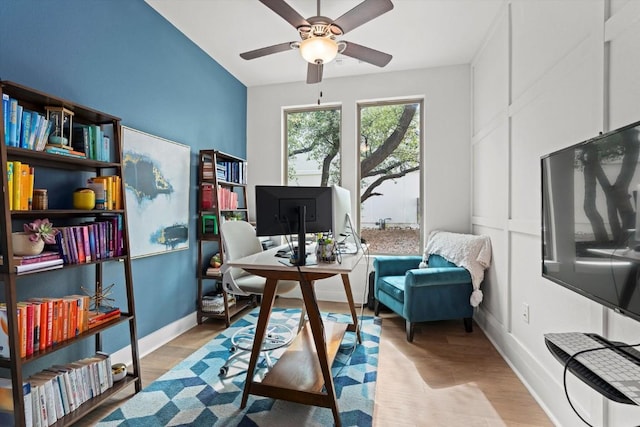 1213 Silver Dollar Trl, Georgetown, TX 78628 - office with baseboards, a ceiling fan, and wood finished floors