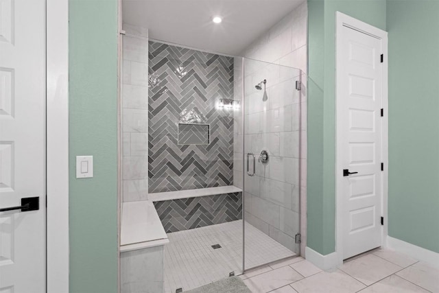 1213 Silver Dollar Trl, Georgetown, TX 78628 - full bathroom featuring a shower stall, tile patterned floors, recessed lighting, and baseboards