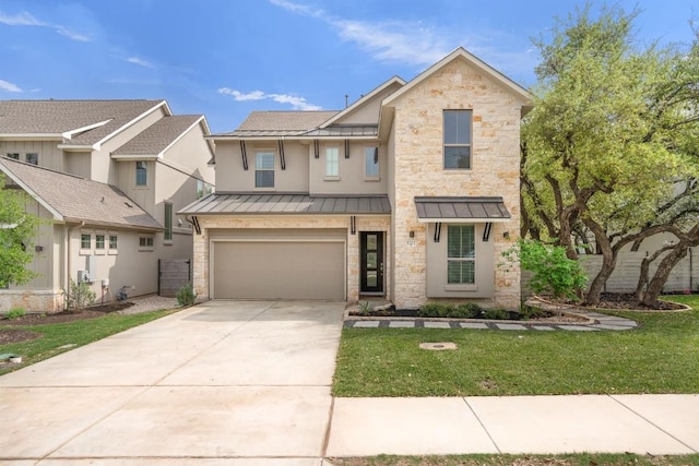 1213 Silver Dollar Trl, Georgetown, TX 78628 - view of front of home featuring a standing seam roof, driveway, a garage, and stone siding