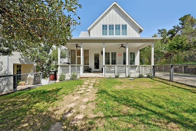 view of front of home featuring ceiling fan, board and batten siding, and covered porch