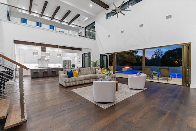 108 Fishspear Ln, Georgetown, TX 78628 - living room with a towering ceiling, dark wood-style flooring, beam ceiling, and a ceiling fan
