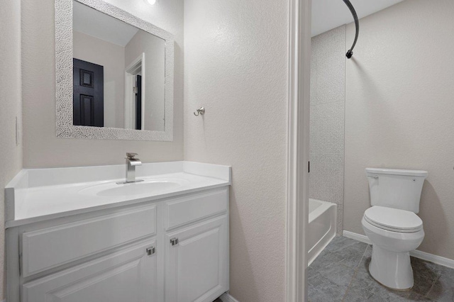 full bathroom featuring tile patterned flooring, vanity, toilet, a textured wall, and baseboards