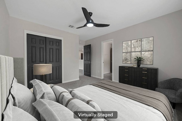 carpeted bedroom with baseboards, visible vents, and a ceiling fan