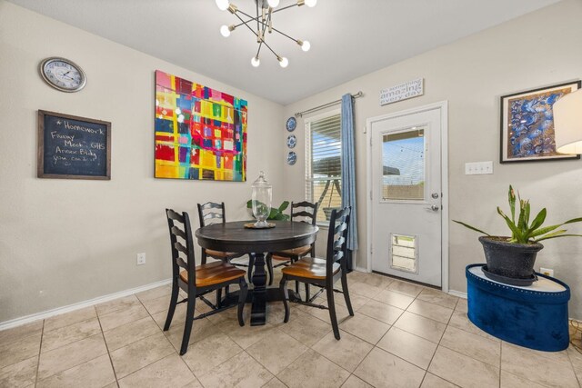 30336 Tiger Woods Dr, Georgetown, TX 78628 - dining area with a chandelier, baseboards, and light tile patterned floors