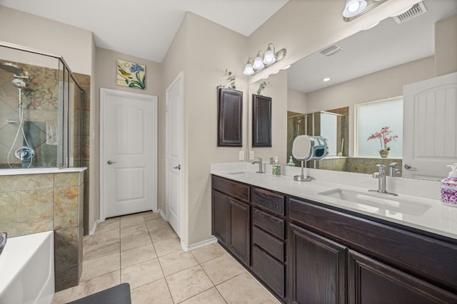 30336 Tiger Woods Dr, Georgetown, TX 78628 - full bathroom with a shower stall, double vanity, a garden tub, and tile patterned floors