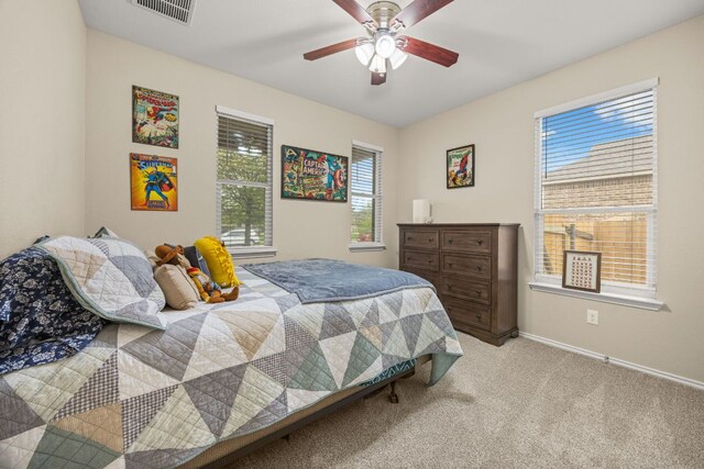30336 Tiger Woods Dr, Georgetown, TX 78628 - carpeted bedroom featuring baseboards and ceiling fan