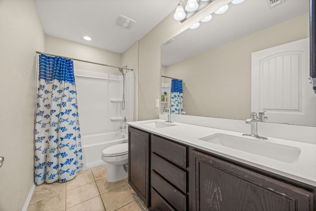 30336 Tiger Woods Dr, Georgetown, TX 78628 - bathroom featuring toilet, double vanity, tile patterned flooring, shower / tub combo with curtain, and baseboards