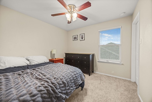 30336 Tiger Woods Dr, Georgetown, TX 78628 - bedroom with carpet flooring, baseboards, and a ceiling fan
