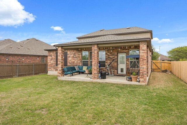 30336 Tiger Woods Dr, Georgetown, TX 78628 - back of property featuring a patio, outdoor lounge area, a shingled roof, and brick siding