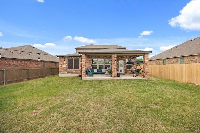 30336 Tiger Woods Dr, Georgetown, TX 78628 - back of house with outdoor lounge area, a patio area, and brick siding