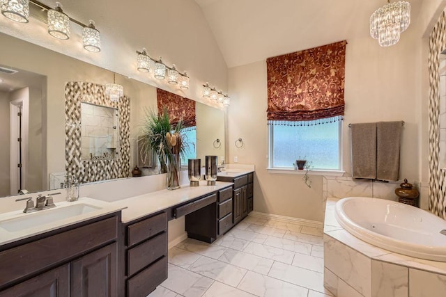 433 Stoney Point Rd, Austin, TX 78737 - bathroom featuring double vanity, a chandelier, a jetted tub, marble finish floors, and vaulted ceiling