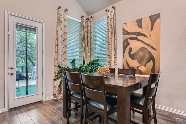 433 Stoney Point Rd, Austin, TX 78737 - dining space featuring vaulted ceiling and dark wood-style flooring