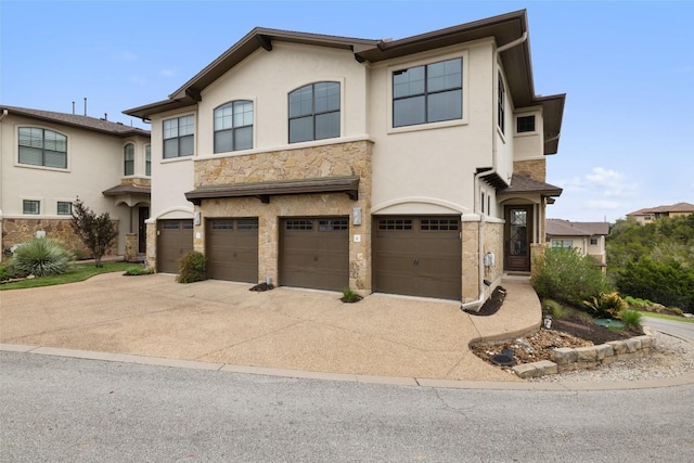 4000 Ranch Road 620 N Unit 8, Austin, TX 78734 - view of property featuring stone siding, a garage, stucco siding, and driveway