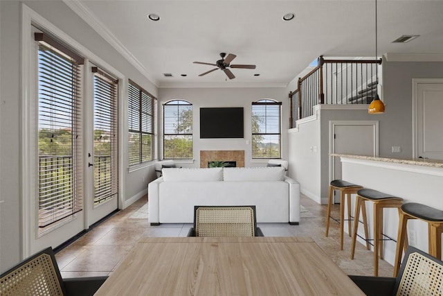 4000 Ranch Road 620 N Unit 8, Austin, TX 78734 - living room with a ceiling fan, crown molding, a fireplace, baseboards, and recessed lighting