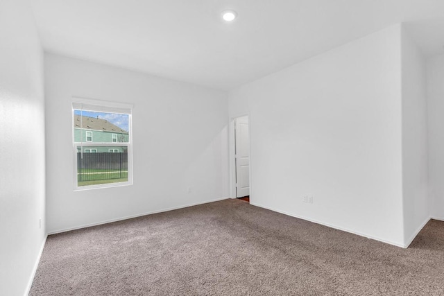 219 George Neggan Ln, Bastrop, TX 78602 - carpeted spare room featuring baseboards and recessed lighting