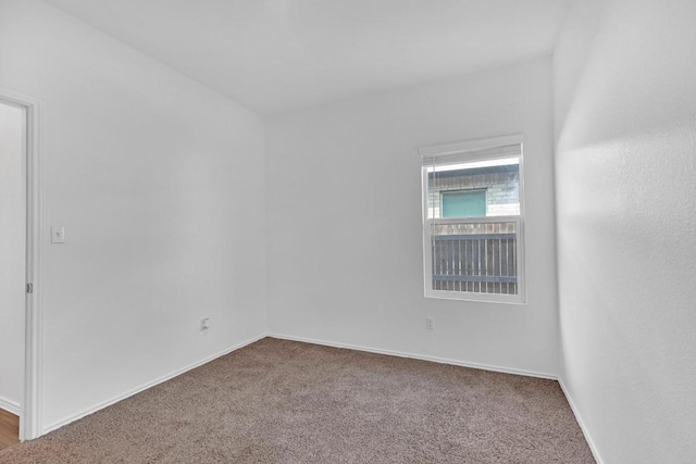 219 George Neggan Ln, Bastrop, TX 78602 - carpeted empty room featuring baseboards
