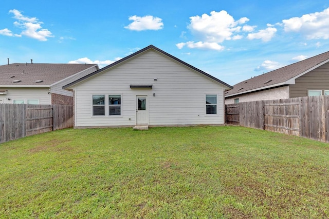 219 George Neggan Ln, Bastrop, TX 78602 - back of house featuring a fenced backyard and a yard