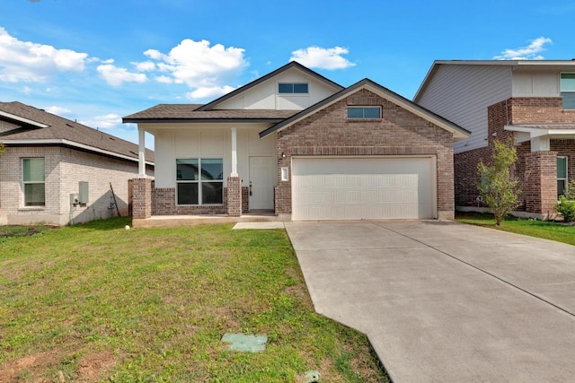 219 George Neggan Ln, Bastrop, TX 78602 - view of front of house with brick siding, a front yard, concrete driveway, and an attached garage